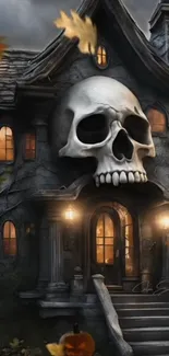 Haunted house wallpaper with skull facade and autumn leaves.