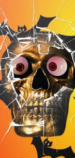 Spooky golden skull with shattered glass effect on orange background.