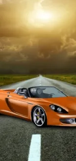 Orange sportscar on open road under a dramatic stormy sky.