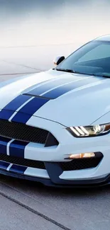 Sleek blue racing car with stripes wallpaper.