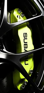 Close-up of a sporty car's neon yellow brake caliper and metal rims.