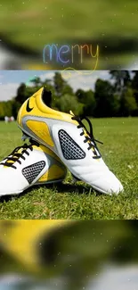 Football shoes on vibrant green field with sunny backdrop.