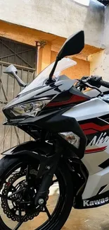 Close-up of a sporty black motorcycle in an urban setting.