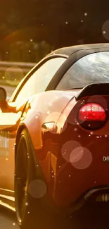 Red sports car driving during sunset on a highway.