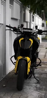 Yellow motorcycle parked on urban street.