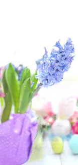 Lilac flower with Easter decorations in soft pastel colors.