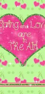 Spring love heart on green background wallpaper.