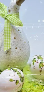 Duck statue with green ribbon and painted eggs on green grass.