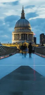 St. Paul's Cathedral at dusk with blue sky and bridge.