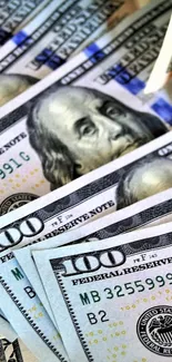 Close-up of stacked 100 dollar bills.