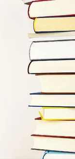 Colorful stack of books set against a white background.
