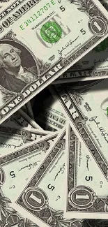 A stack of US dollar bills forming a money-themed wallpaper for mobile devices.
