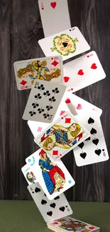 Artistic stack of playing cards on rustic wood