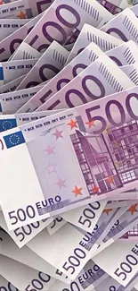 A pile of 500 Euro banknotes in vibrant colors.
