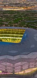 Aerial view of illuminated stadium at night.