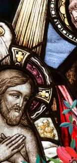 Stained glass art with religious figures and colorful designs.