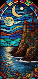 Stained glass window with a castle and moonlit sea.