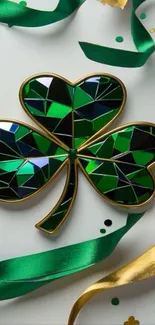 Stained glass shamrock with gold ribbons.