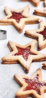 Star-shaped cookies with jam center on a light background.