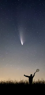 Silhouette under a starry night sky with a visible comet trail.