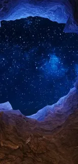 Starry sky viewed from a cavern with rugged rock formations.