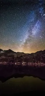 Starry night sky over mountains with shooting star.