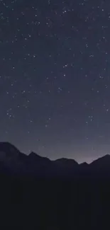 Starlit night sky above mountains for mobile wallpaper.