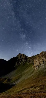 A starry night sky over a mountainous landscape in a mobile wallpaper.