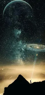 A lone figure stands under a starlit galaxy.