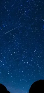 Mobile wallpaper showing a starry night sky with a shooting star.