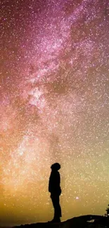 Silhouette under a vibrant starlit night sky, ideal for mobile wallpaper.