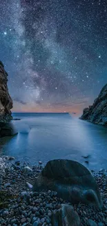 Starry night over a rocky seascape with a tranquil view.