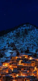 A starlit winter village illuminated with warm lights against a deep blue night sky.