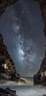 Starry sky visible through cave with ocean view.