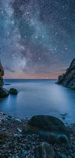 Rocky coastline under a starry night sky.