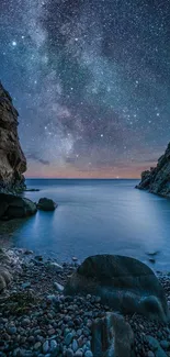 Starry night sky over a tranquil coastal scene with rocks and the Milky Way.