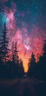 Starry night sky over forest with vibrant colors.