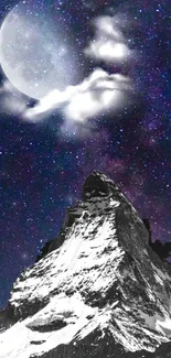 Snow-capped mountain at night with a starry sky and a bright moon.