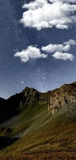 Starry night sky over rugged mountains.