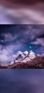 Starry night sky over snowy mountains wallpaper.