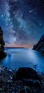 Starry night sky over a tranquil beach with deep blue ocean.