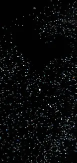 Black wallpaper with shimmering starry specks on a dark background.