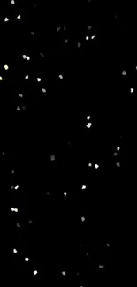 Black wallpaper with shimmering white specks resembling stars.