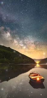 Starry night sky with Milky Way reflected on river with a boat.