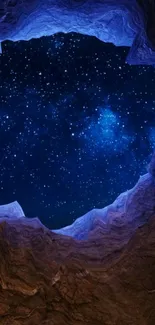 Starry sky through a cave opening at night.