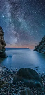 Starry night over a calm coastal scene, with rocky shores and serene water.