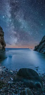 Starry night sky over a tranquil rocky shore.