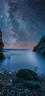 Starry night sky over calm sea and cliffs, perfect for mobile wallpaper.