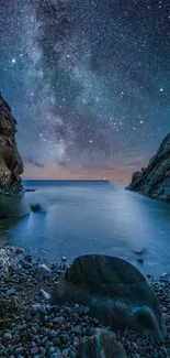 A serene starry night over a calm coastal scene with a rocky foreground.