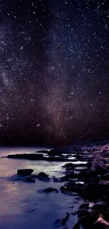 Serene starry night over a rocky coastline.